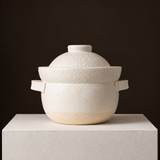 KAGETSU INAHO SHIRO white ceramic 2-go rice cooker and steamer set, shown with lid against a dark backdrop.